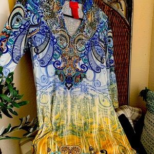 A beautiful bright colored tunic with long sleeves and metallic beading